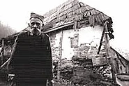 Grujicic in front of his log house in May 2001