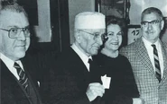 Leoz-Ortin with his children and holding the photo of his deceased son Rafael (undated)