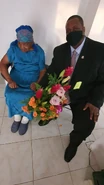 Aleatha Fraser on her 104th birthday with the Leader of the Opposition of the Virgin Islands Andrew Fahie in 2021.