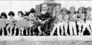 Izumi (center) with his family (undated).