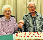 Kruger celebrating his 104th birthday with Olive Reade (also aged 104) in 2014