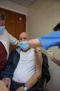 Beiso receiving his second dose of the Pfizer/BionTech vaccine on 1 February 2021 at the age of 100