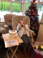 Ada Thompson.jpg (80 KB) Thompson on her 110th birthday in 2020, carrying the letter from the Queen