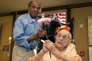 On her 116th birthday in 2014, with her son Joe Weaver (1921–2018)