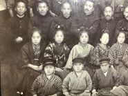 Nakachi (second from the left in the second row) in 1913, when she received an award for excellence.