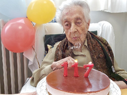 Branyas Morera blowing out the candles on her 117th birthday in 2024.