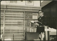 Chuman (age 58) reading a book near his desk in 1975.