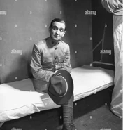 Berlin (age 54) in front of his bed on a boat during World War 2 on June 30, 1942.
