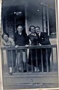 Juniewicz (the lady leaning on the railing) in an undated photo