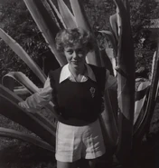 Johns (age 24) posing infront of a giant plant on September 15, 1948.