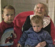 Lajosné Buzáky at age 108 with her great-grandsons.