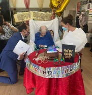 Reid on her 111th birthday with Dave Sharma in 2021