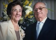 Galvani as an elderly woman, with her husband