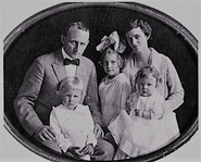 Aged 43, with his wife and his three children