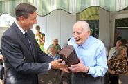 Niko Dragoš (aged 108), and the then President of Slovenia Borut Pahor.