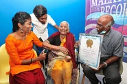 Abukutty being recognised as Malaysia's oldest living woman by Malaysia Book of Records, 19 June 2020.