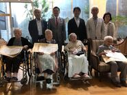 At age about 111, second one from the right in front row