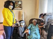 Skeen (aged 110) receiving her first dose of the Pfizer–BioNTech COVID-19 vaccine on 16 March 2021