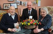 Smith celebrating his 109th birthday in 2017 with daughter Irene Noble and Councillor Mac Roberts