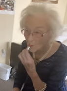 EdieLipstick.png (179 KB) Ceccarelli on her 113th birthday in 2021, putting on her own lipstick