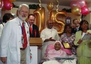 Baines on her 115th birthday with Dr. Stephen Coles in 2009.