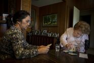 Berg in January 2020, aged 109, playing cards with her longtime caregiver Rachel Gelanga