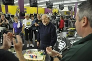 Smith on his 102nd birthday at Planet Fitness. His wife Priscilla is to the left in the "PF" shirt.