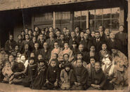Koume Kodama (sitting in the very right of the second row) and Umeno Sumiyama (third one from the left in front row) in their earlier years