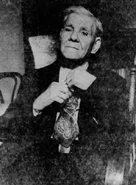 Riddle (age 104) putting on a tie to get ready for his 105th birthday celebration right before his 105th birthday on April 15, 1951.