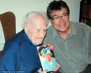 Dean and his son Christopher with his card from the Queen on his 100th birthday in 2002