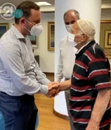Ibush Ademi (aged 103) during vaccination in August 2021.