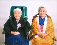 Nahi Yonamine (aged 110) with her second daughter Toyo (aged 87) in April 2018