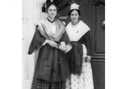 Broux (left) in Arlesian costume