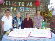 On her 110th birthday, with her daughters, (right; aged 91) and (left; aged 87), the other daughter (aged c.85) in 2015.