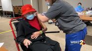 Hawkins receiving her first dose of the Pfizer–BioNTech COVID-19 vaccine around 8 January 2021 at the age of 104