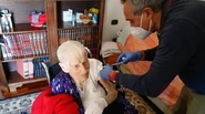 Ercolani (aged 110) in March 2021, being vaccinated against COVID-19