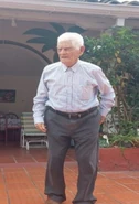 Standing at the age of 109 (claimed 114), in December 2024.