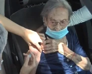 Gugliotti at the age of 110, being vaccinated against Covid-19.