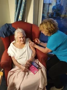 Felicity Crump vaccine1.jpg (180 KB) Crump (aged 107) receiving her first dose of the COVID-19 vaccine in January 2021