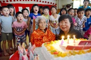 On her 114th birthday in 2019, with kindergarten kids