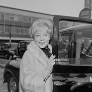 Johns (age 42) enters a taxi at London Airport, UK, 15th May 1966.