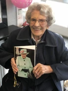 Connie Titchen Card.jpg (386 KB) Titchen holding a card from the Queen on her 106th birthday in September 2019
