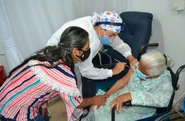 Higuita de Robledo being vaccinated against Covid-19 at the age of 110.