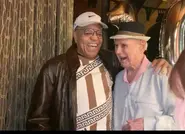 On his 102nd birthday in 2024, next to Berry Gordy