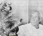 Reed (age claimed 114) putting ornaments on his Christmas tree on December 9, 1974.