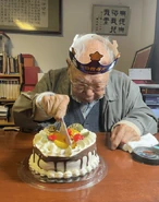 Aged 107, cutting a cake on Christmas Day 2022
