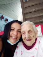 Abreu Columbie (right) on her 111th birthday in 2021