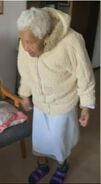 Inacia Carmelino standing at the age of 111.