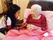 Goldie in her bed at age 112 in 2014 or 2015 and a Relative