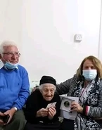 Aged 109, with her son after receiving a honorary plaque from Municipality of Lefkonoiko in December 2021.